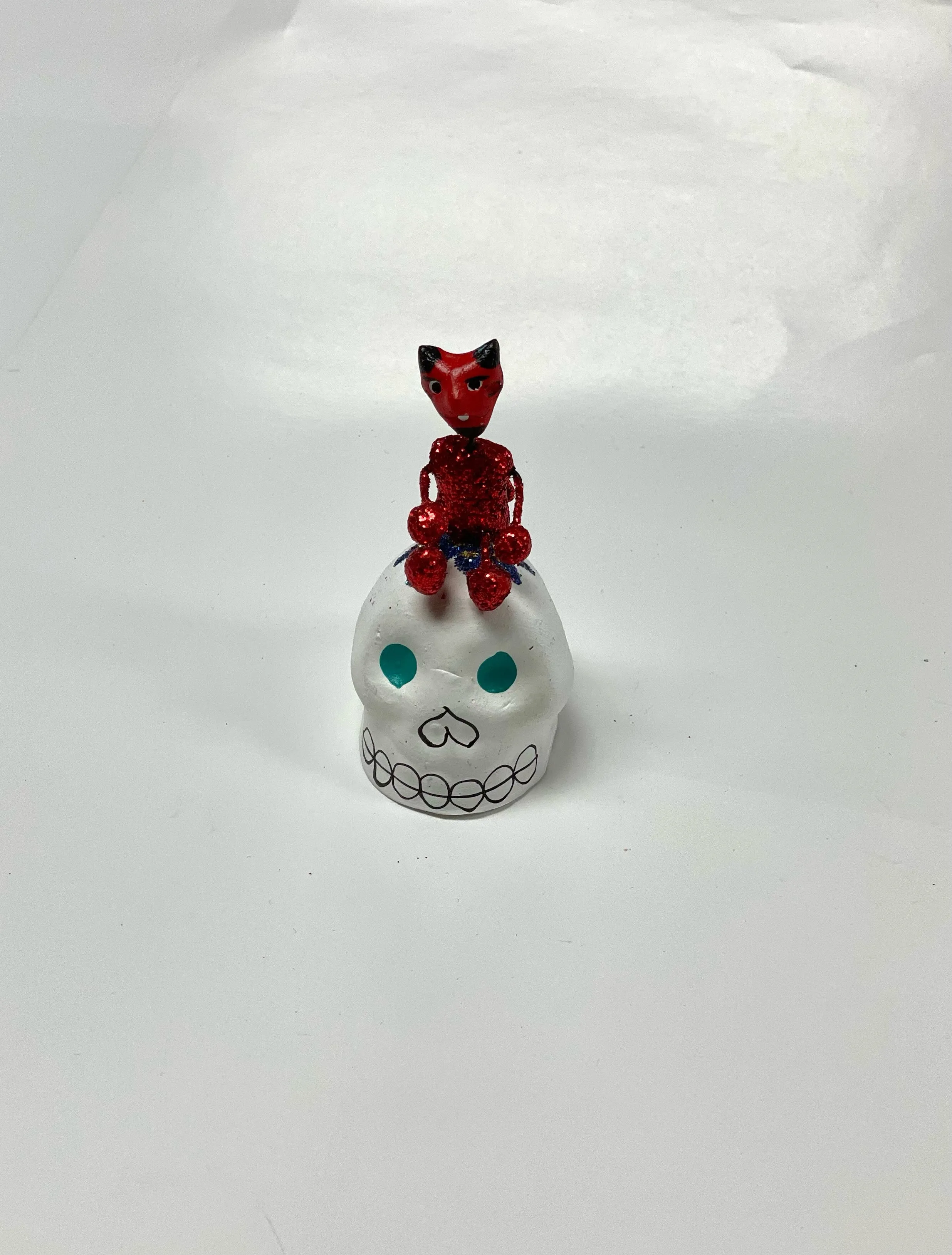 Calavera with figure on top