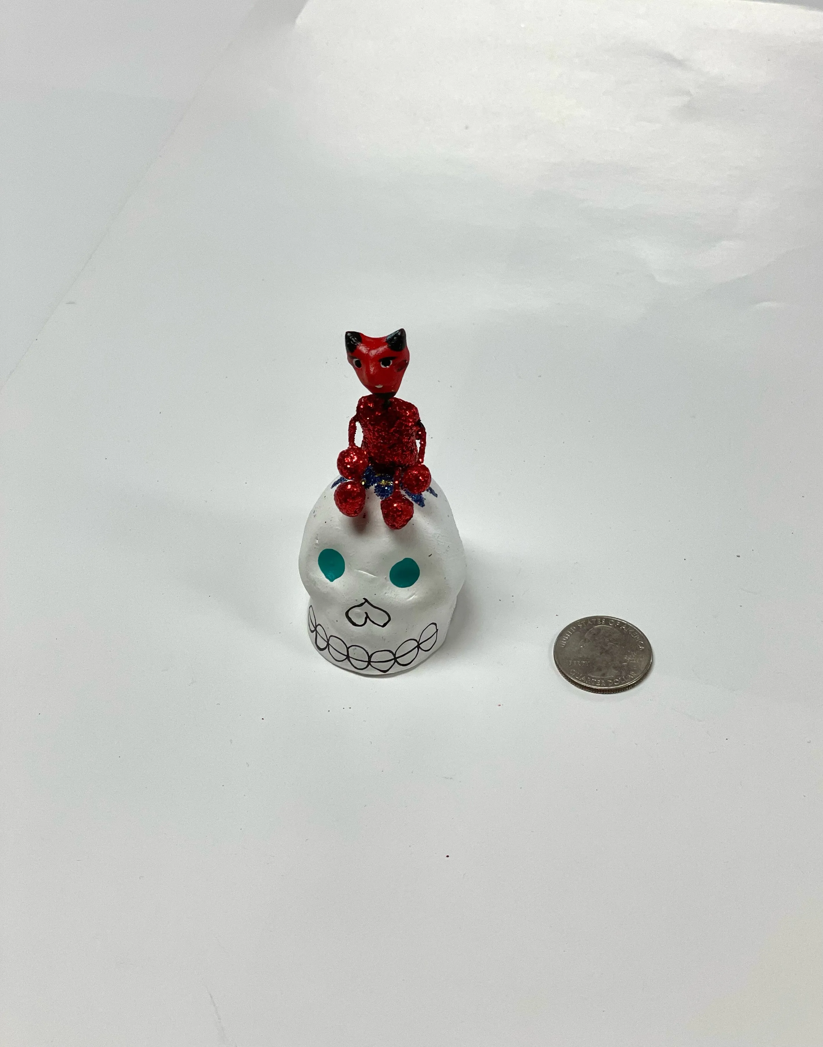 Calavera with figure on top